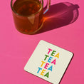Load image into Gallery viewer, Tea themed drink coaster with colorful 'TEA TEA TEA' text next to a glass of tea on a pink background.
