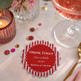Load image into Gallery viewer, Red & white stripe drink tokens pack of 50 placed on a dining table with a drink and decorative elements.