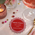 Load image into Gallery viewer, Red & white stripe drink tokens pack of 50 placed on a dining table with a drink and decorative elements.