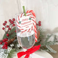 Load image into Gallery viewer, Candy Cane Christmas edible drink toppers decorating a festive glass with a holiday label and candy cane.