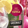 Load image into Gallery viewer, Just A little Tipple Bottle Charm Gift Tag on a bottle with a glass of sparkling beverage and lemon slices.