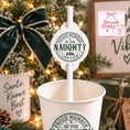 Load image into Gallery viewer, Proud Member Of The Naughty List Christmas Paper Straw Toppers in festive drink setting with Christmas decorations.