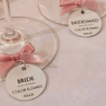 Load image into Gallery viewer, Wedding Wine Charms for Bridal Party with tags for Bride and Bridesmaid with pink bows.