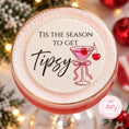 Load image into Gallery viewer, Tis The Season To Get Tipsy edible drink topper on a festive cocktail garnished with cherries.