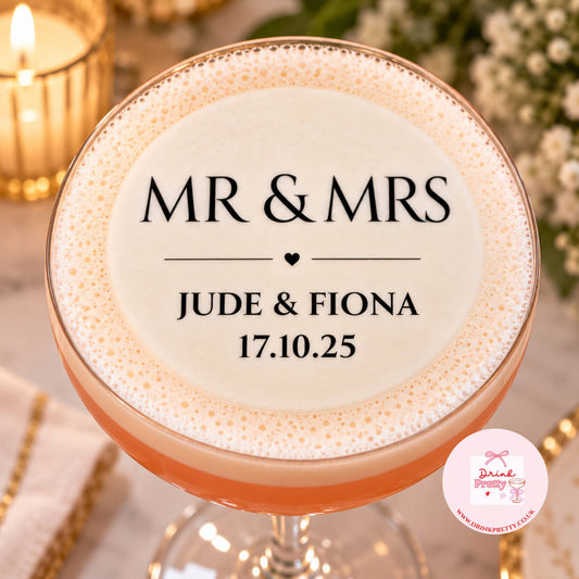 Mr & Mrs Wedding Edible Drink Toppers on a cocktail with names Jude & Fiona and date 17.10.25, perfect for weddings.