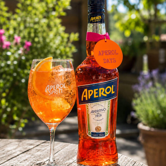 fun bright and bold bottle tag saying Aperol days