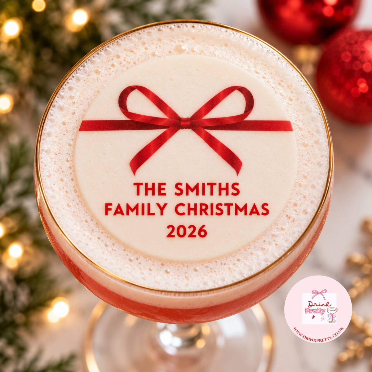 Christmas ribbon edible drink toppers on festive cocktail glass featuring family name and year.