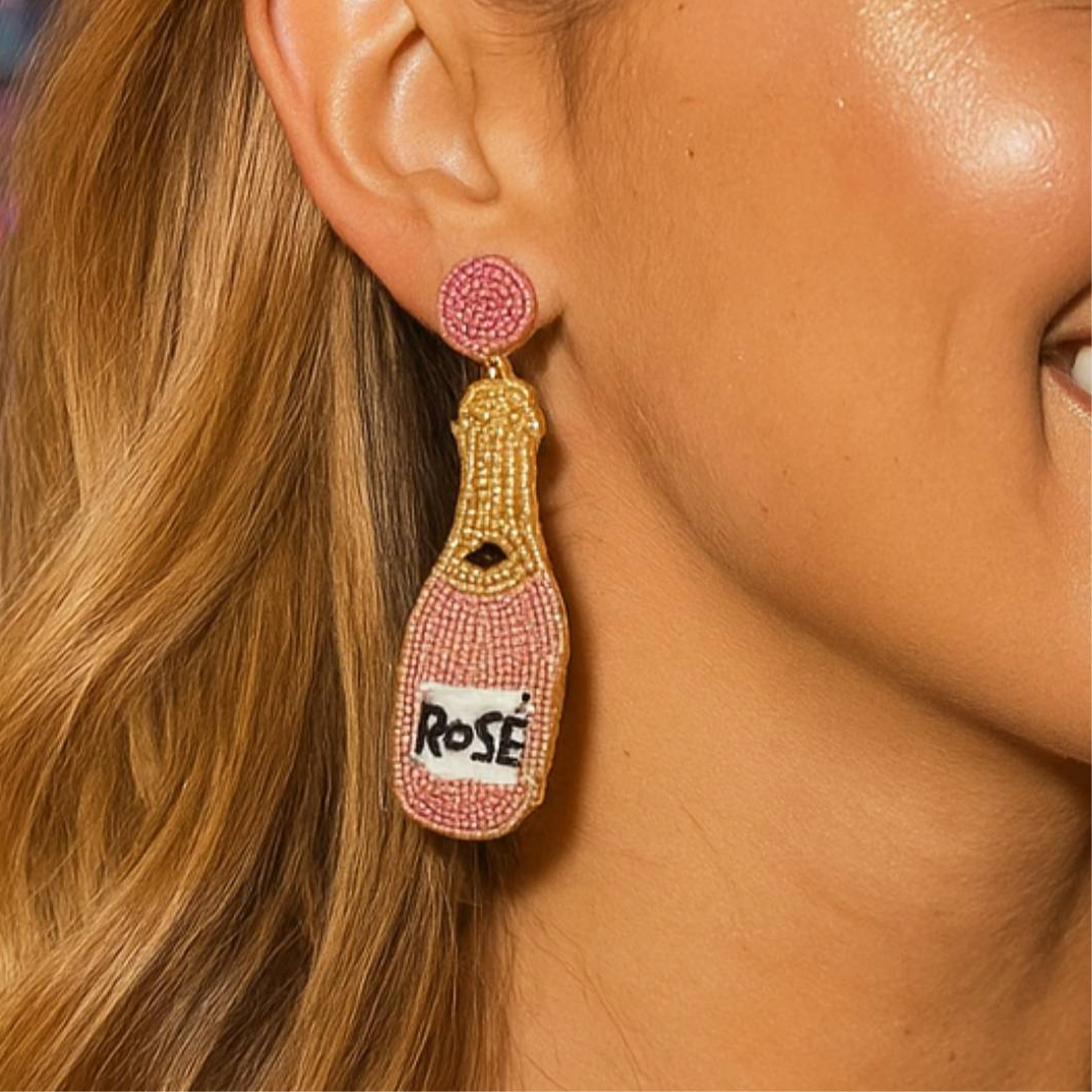 Rose Wine Bottle beaded earrings My Doris worn by a model, showcasing colorful pink and gold beads.