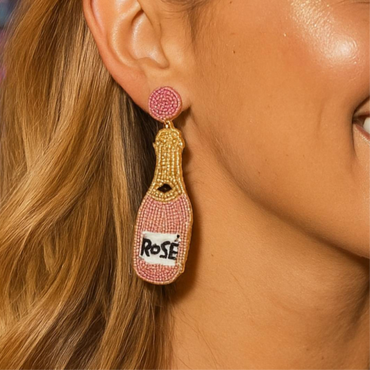 Rose Wine Bottle beaded earrings My Doris worn by a model, showcasing colorful pink and gold beads.