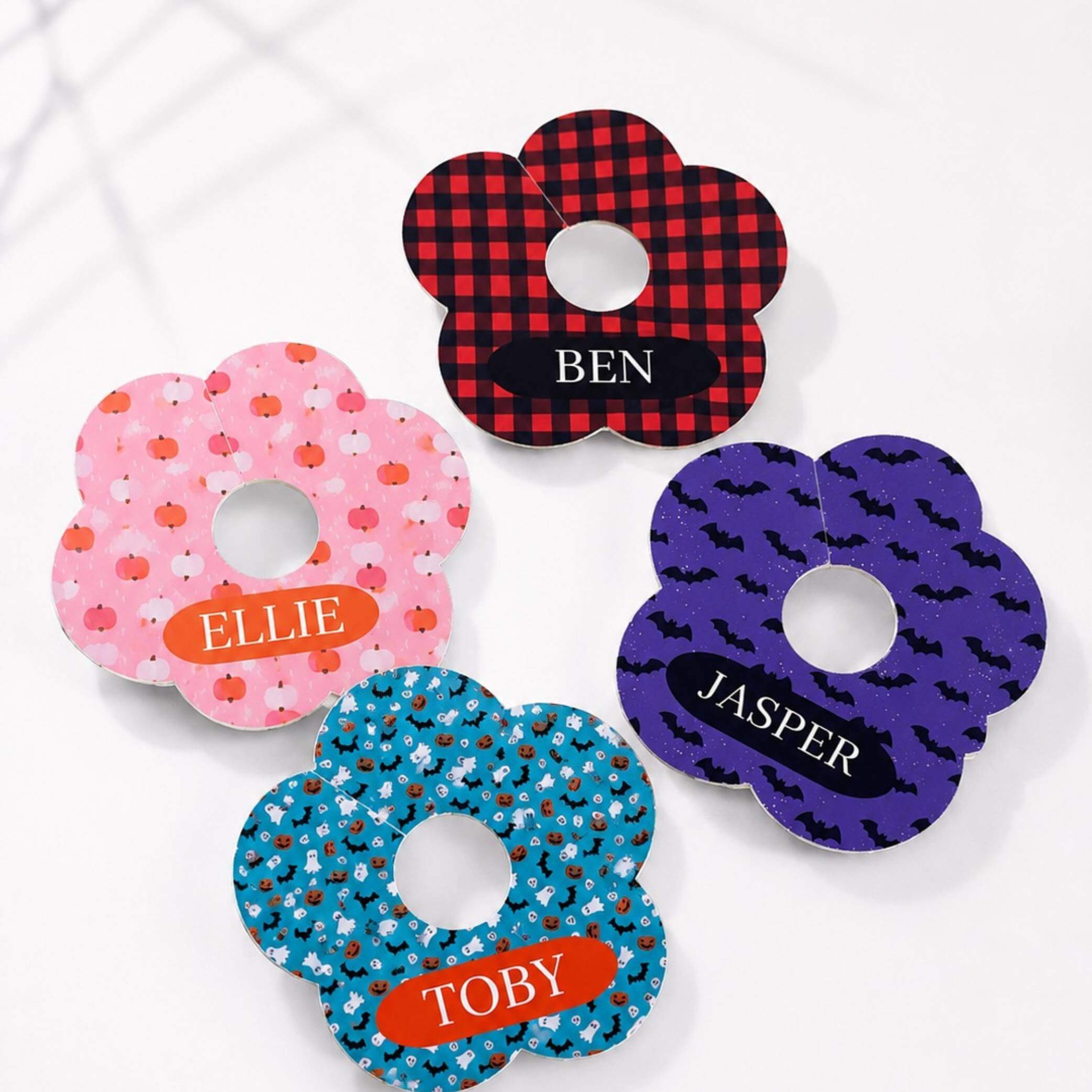 Autumn Check Personalised Halloween drink markers featuring colorful flower designs with names for easy identification.