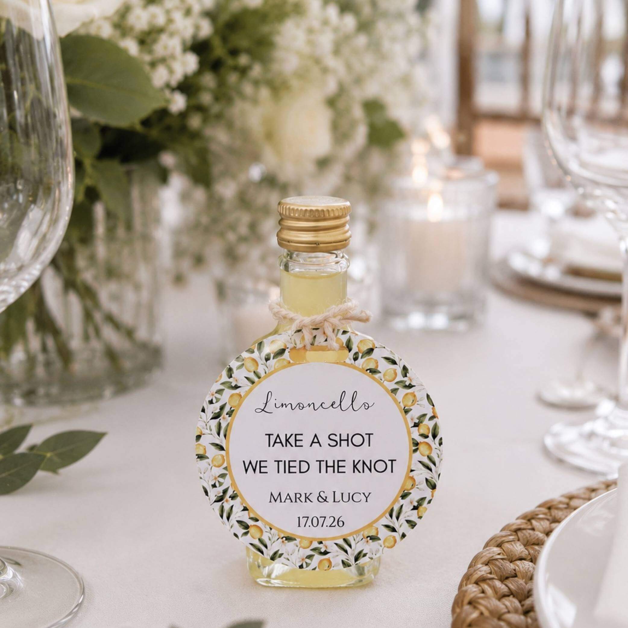 Limoncello Bottle Guest Favour Tags displayed on a mini limoncello bottle for wedding celebrations.