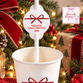 Load image into Gallery viewer, Personalised Christmas Straws With Red Bow Toppers displayed in a festive cup with custom name tag and red bow.
