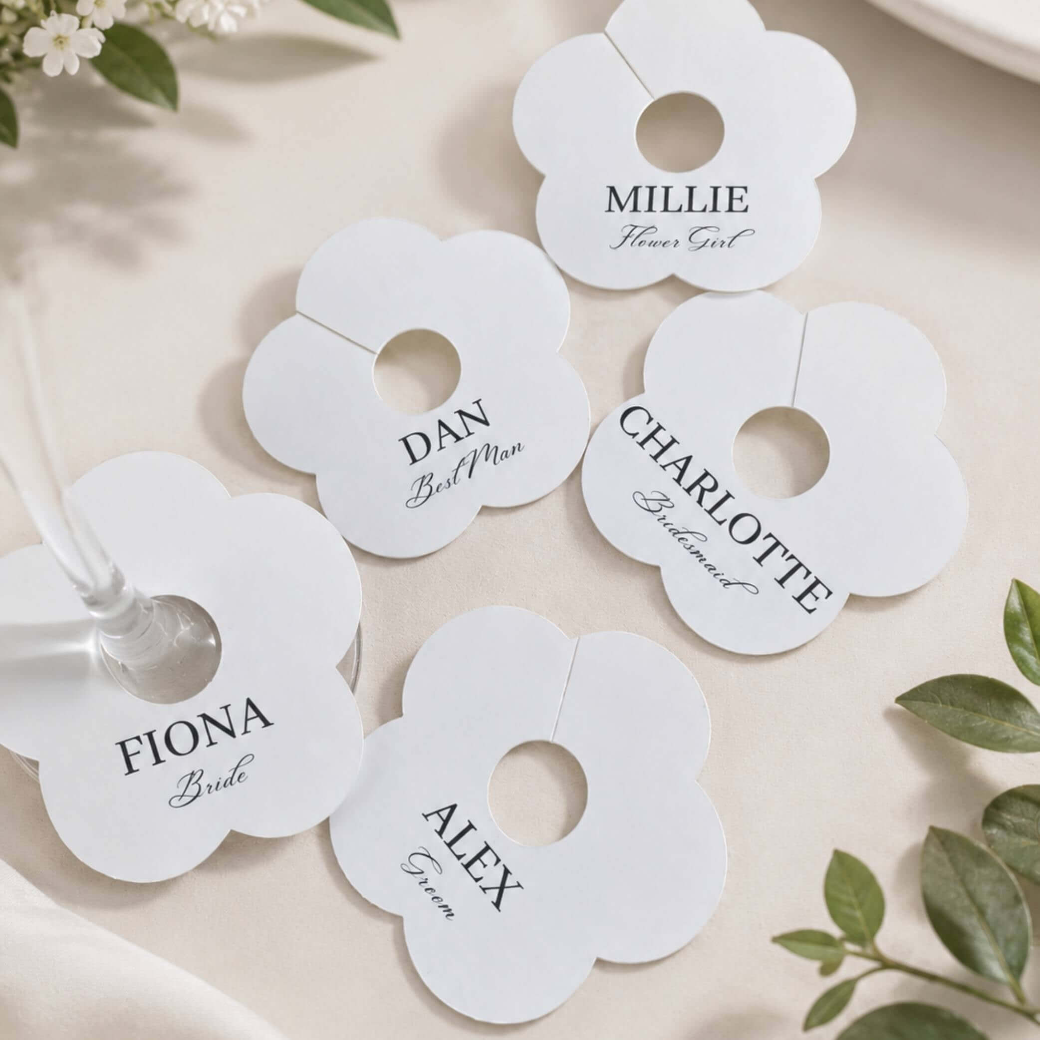Wedding Attendees white personalised name drink marker with names for bridesmaids and groomsmen at a wedding celebration.