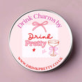 Load image into Gallery viewer, Mr and Mrs wine charms set in a stylish reusable tin with a pink and white design.
