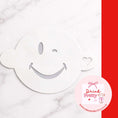 Load image into Gallery viewer, Reusable cocktail coffee stencils featuring a smiley face design for decorating drinks.
