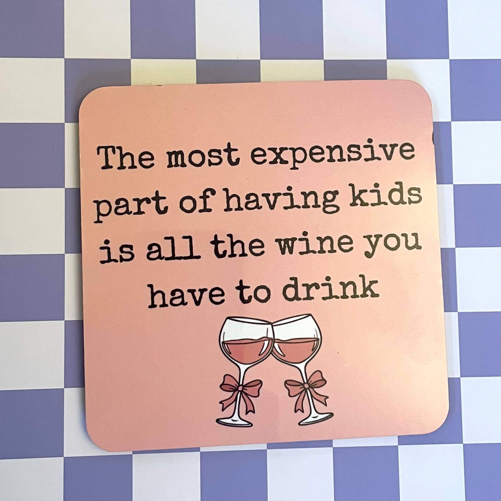 Kids and wine drink coaster featuring a humorous quote about wine and kids, ideal for wine-loving mothers.