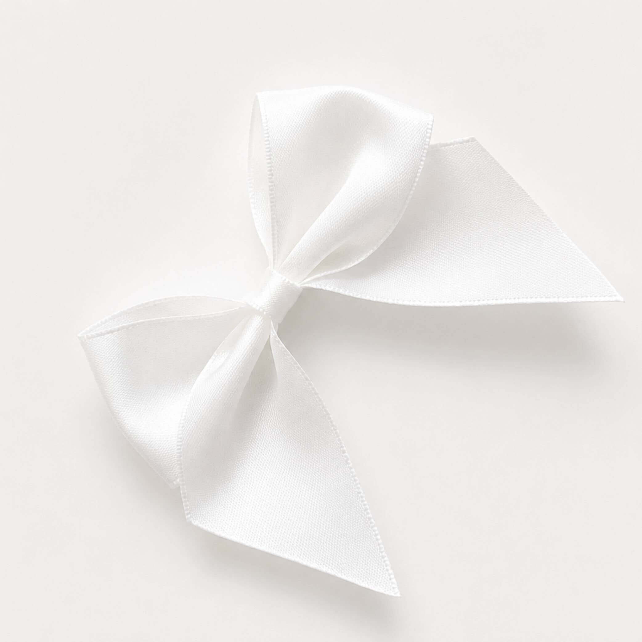 White Pre-Tied Satin Bows 10cm Pack of 6 - Luxurious satin ribbon bow for gifts and decorations.