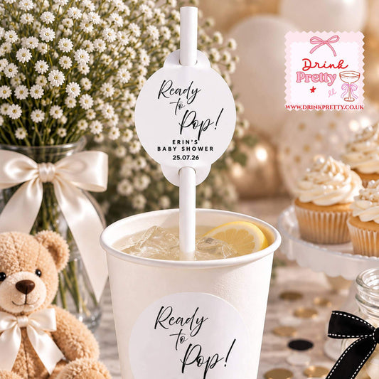 Ready to Pop Straw Toppers for baby shower drinks featuring personalized designs and a lemon slice in cup.