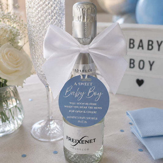 Baby shower pop the fizz bottle favour tags on mini prosecco bottle with bow, perfect for celebrating a new baby.