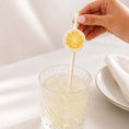 Load image into Gallery viewer, Limoncello paper straw toppers in a drink, featuring a lemon slice design for weddings and celebrations.
