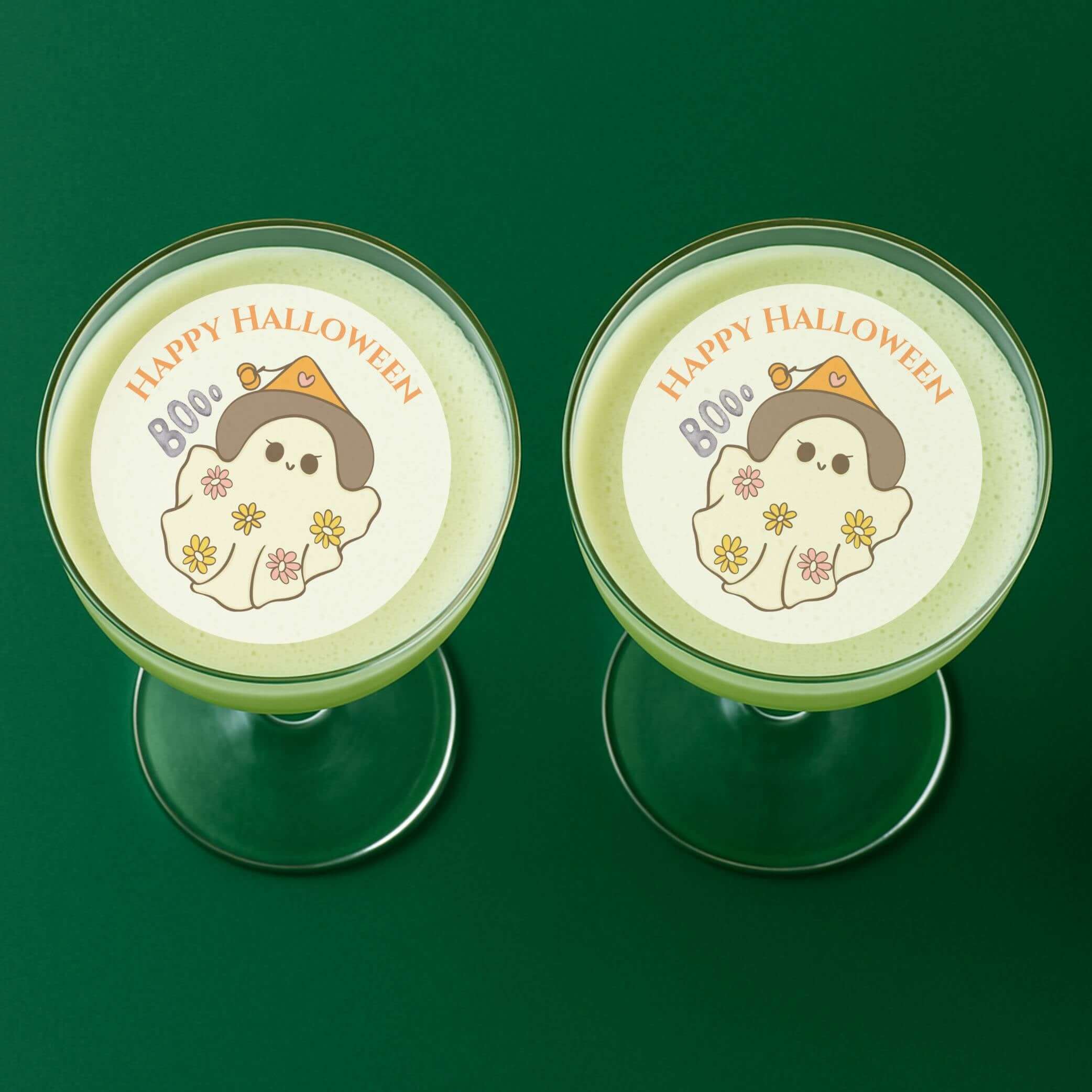 Two cocktails with Boo Halloween drink toppers, perfect for spooky Halloween parties.