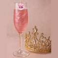 Load image into Gallery viewer, Pink sparkling drink topped with Team Glinda edible topper next to a golden crown.
