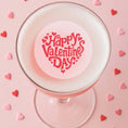 Load image into Gallery viewer, Valentines Day edible drink toppers on a cocktail with heart decorations for a festive celebration.
