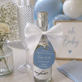 Load image into Gallery viewer, Baby shower name pop the fizz bottle favour tags on a prosecco bottle with a decorative bow and celebratory decor.
