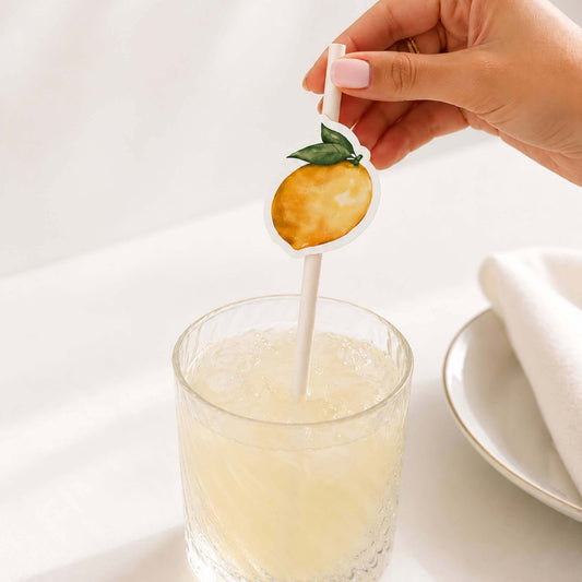 Limoncello paper straw toppers with lemon design in a cocktail glass for summer celebrations.