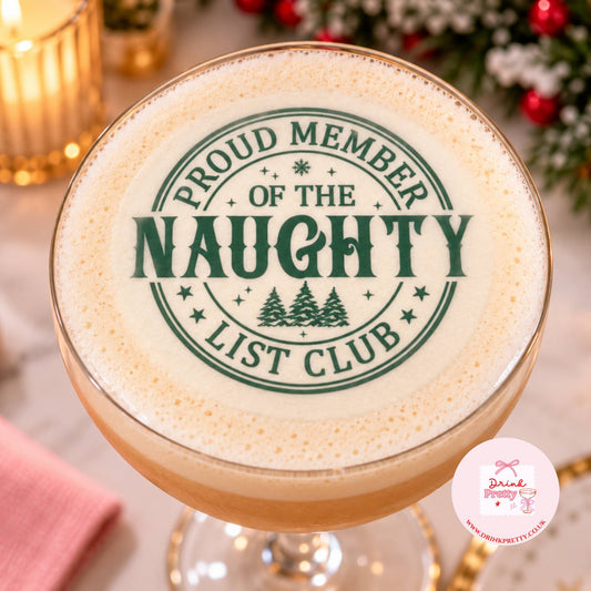Naughty List Edible drink toppers for Festive cocktails on a cocktail glass with festive design.