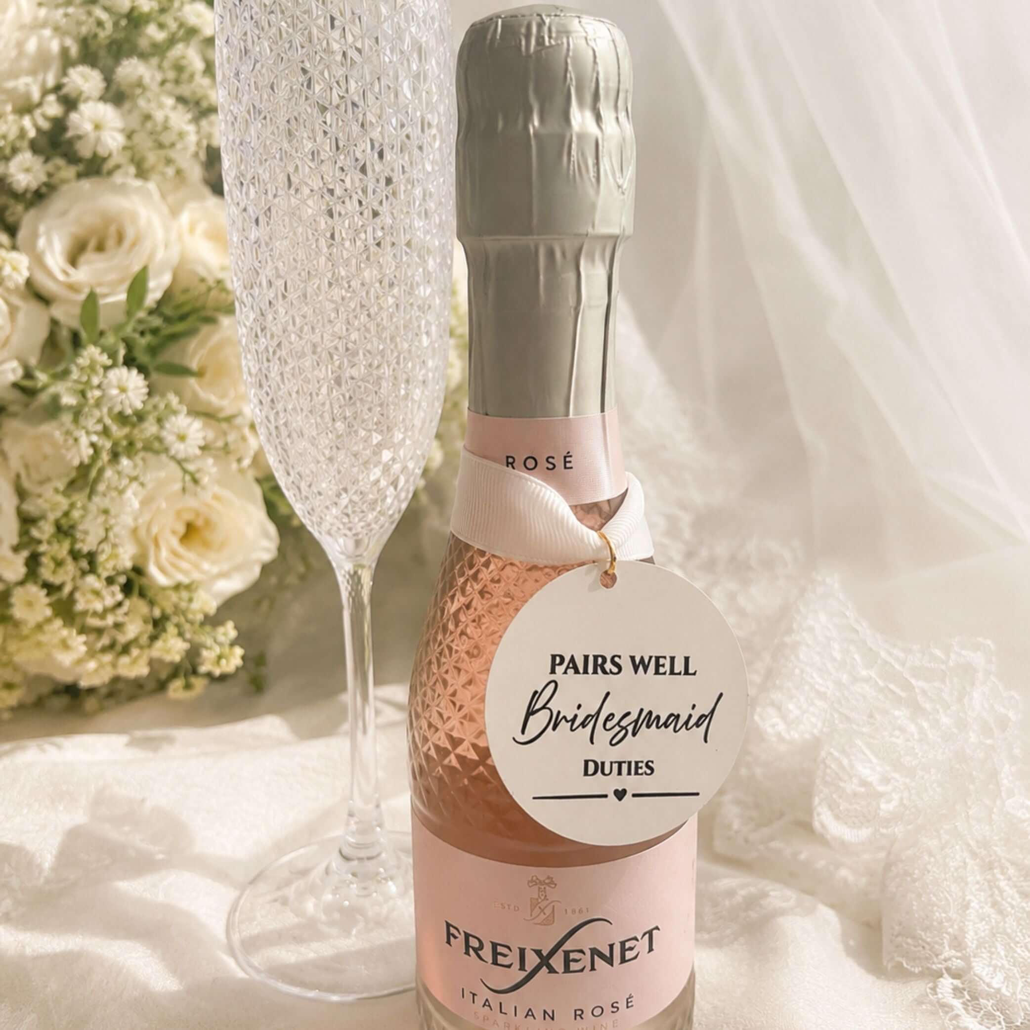 Wedding Pairs Well with bottle charm tag on Freixenet Italian Rosé bottle with champagne flute.
