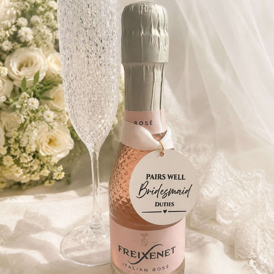 Wedding Pairs Well with bottle charm tag on Freixenet Italian Rosé bottle with champagne flute.