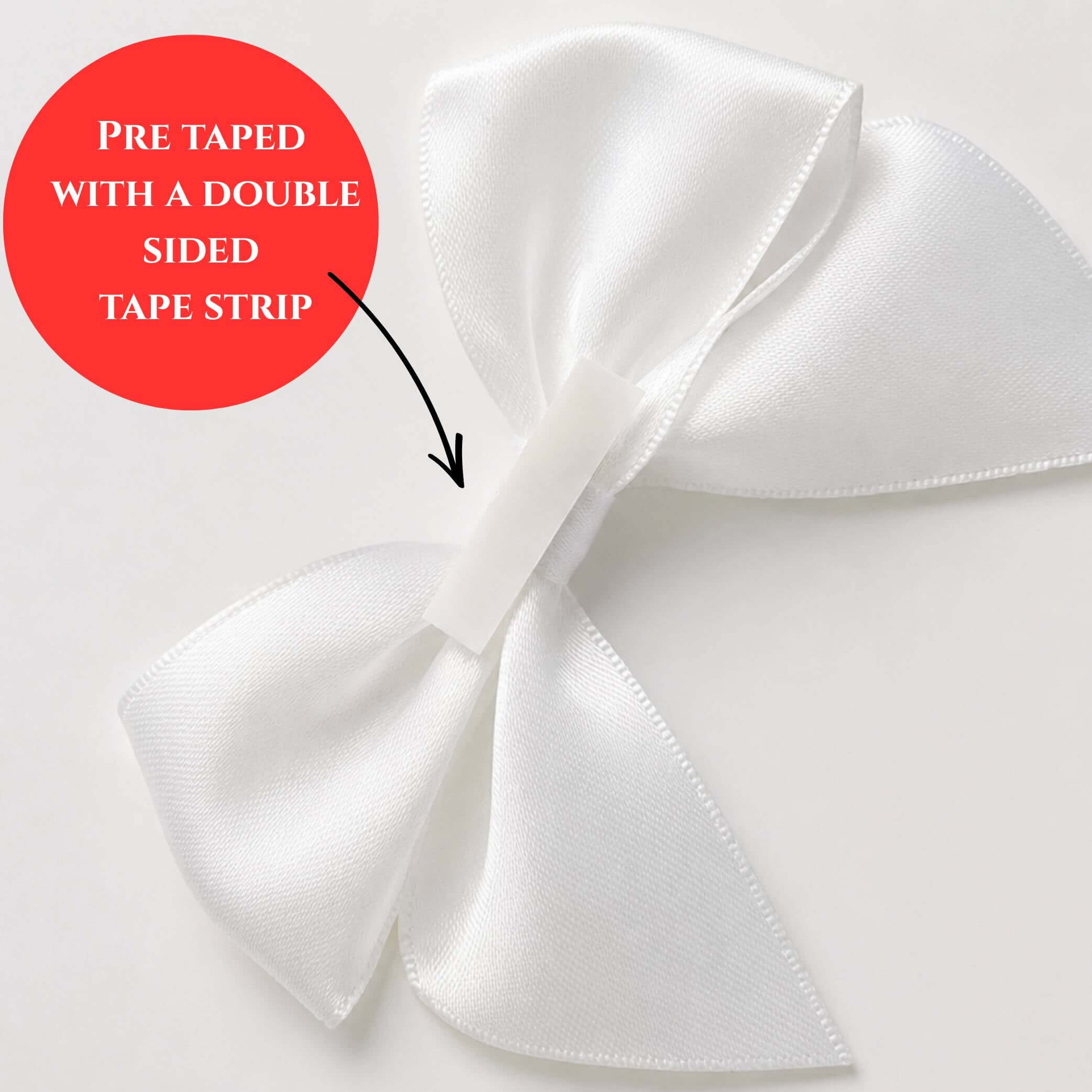White pre-tied satin bows 10cm pack of 6 with double-sided tape for easy application.