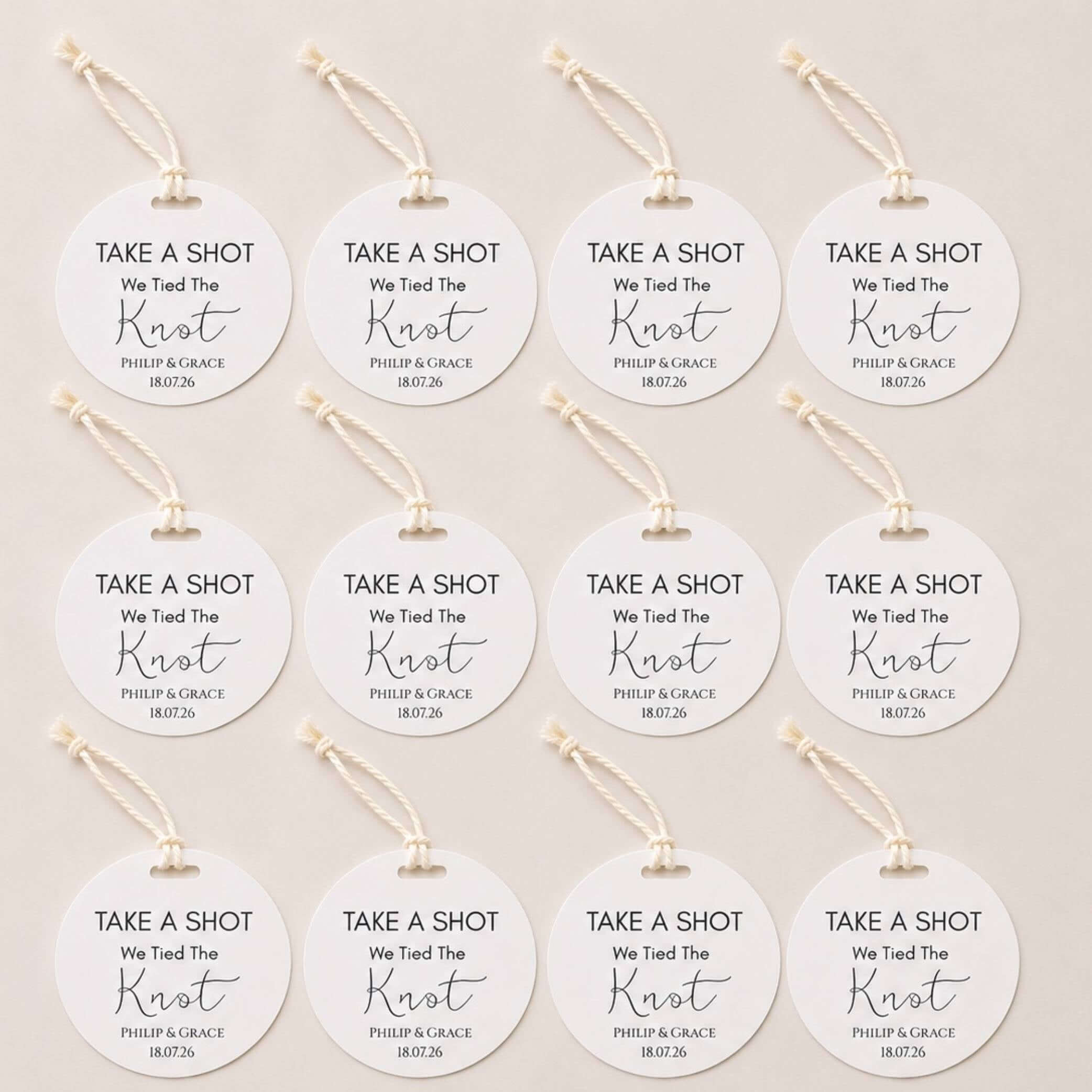 Take A Shot wedding favour bottle tags displayed in a pack of 12 for wedding celebrations.