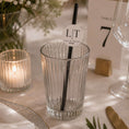 Load image into Gallery viewer, Occasion paper straws personalised initials toppers in a glass on elegantly decorated table with candlelight.
