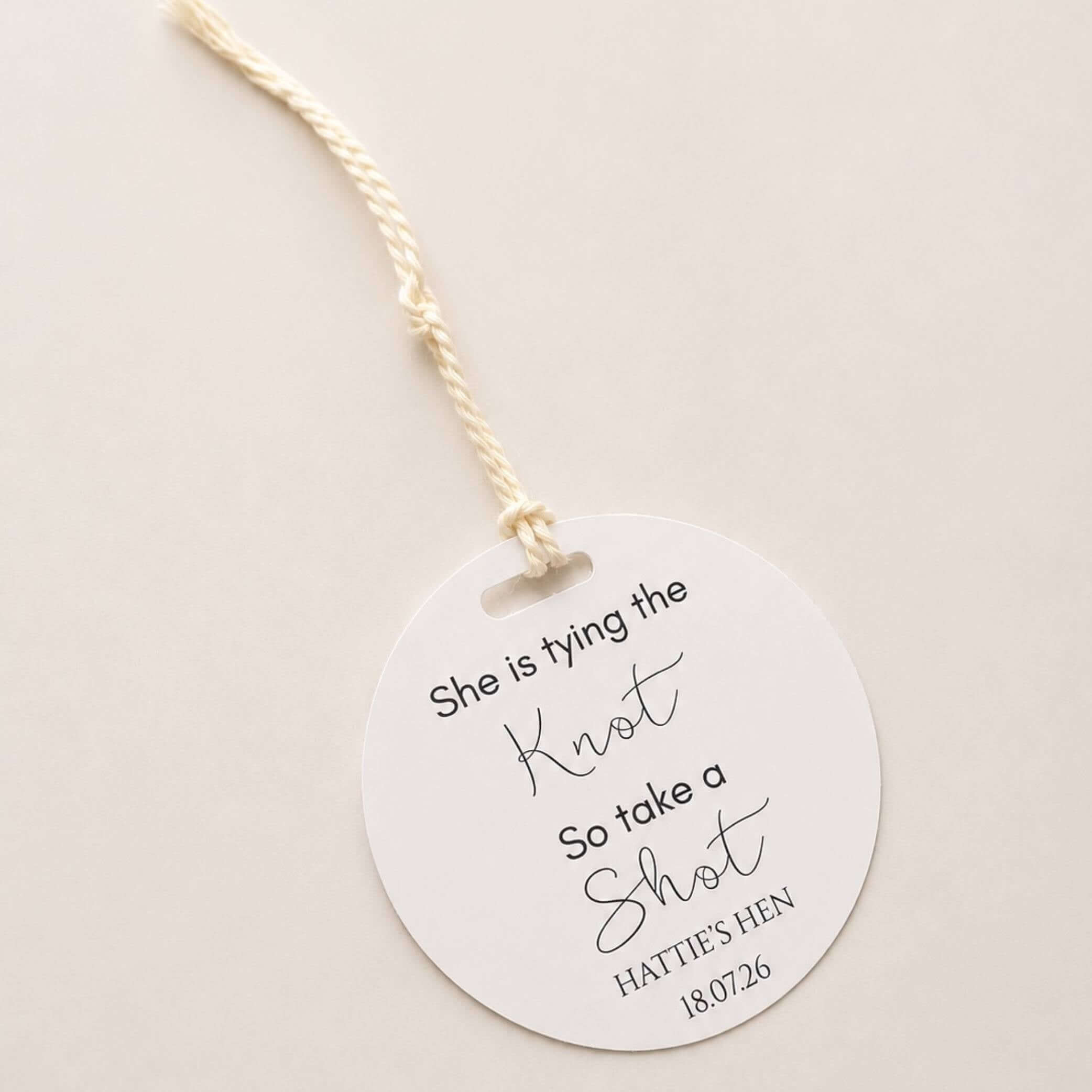 She is tying the knot bottle favour tags featuring elegant design for bridal celebrations.