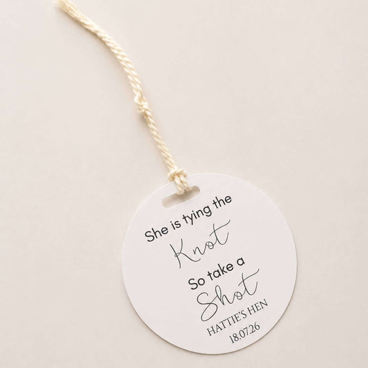 She is tying the knot bottle favour tags featuring elegant design for bridal celebrations.