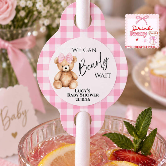 We Can Bearly Wait pink gingham straw topper for Lucy's baby shower, featuring a cute teddy bear design.