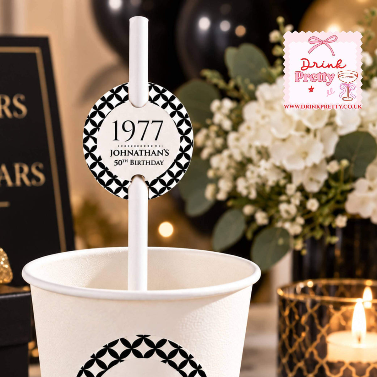 Birthday Year Paper Straw Toppers featured on a paper cup for a 50th birthday celebration.