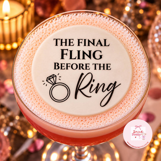 Final Fling Before the Ring Edible Cocktail Toppers on a pink cocktail with decorative ring design.