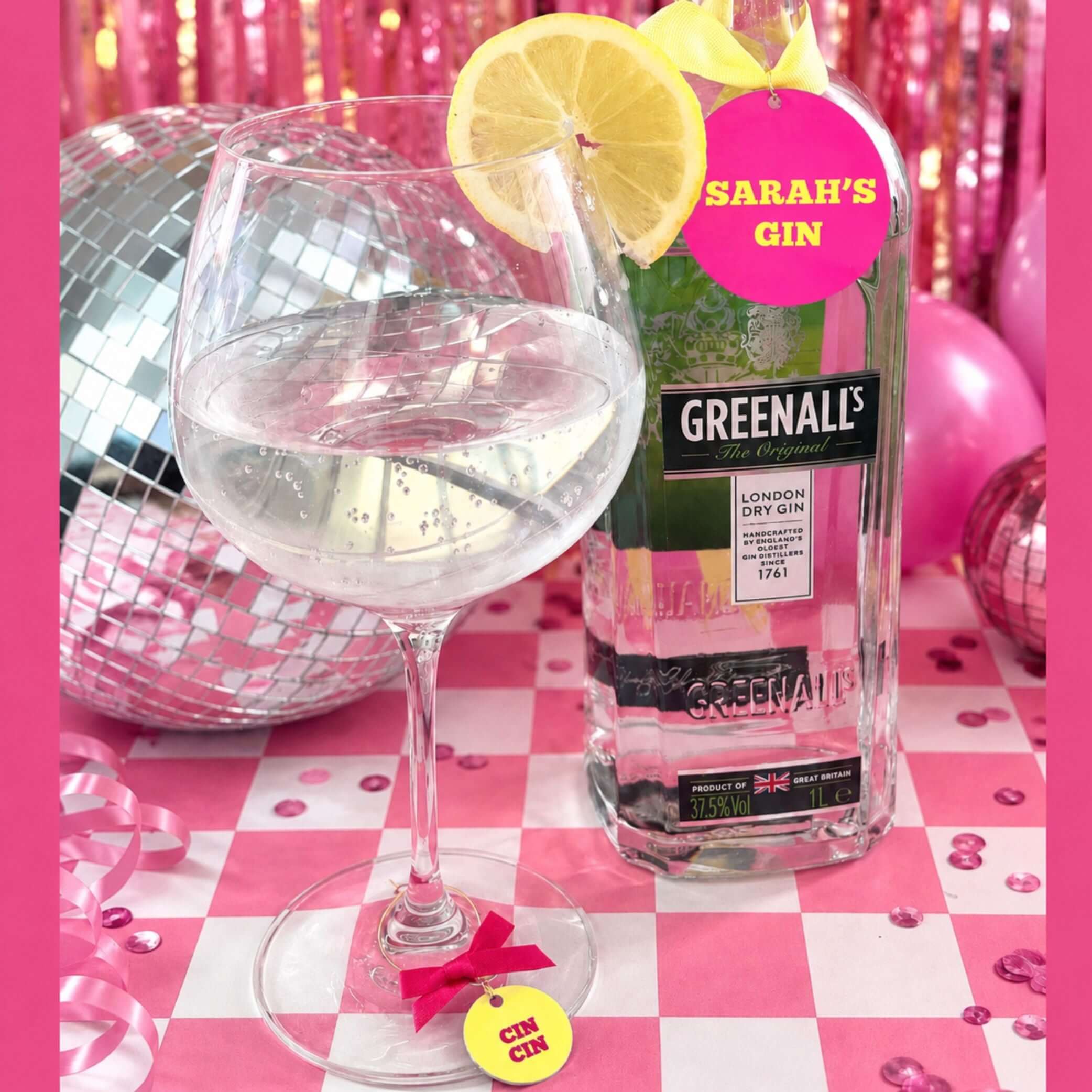 Personalised Text & Message Bottle Charm Gift Tag on a bottle and cocktail glass with lemon garnish.